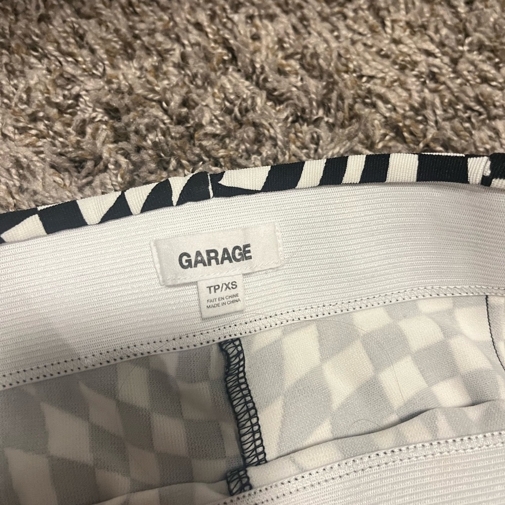White and black flare pants